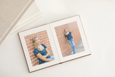 An heirloom photo album featuring senior portraits printed on fine art paper — Raleigh portrait photographer.