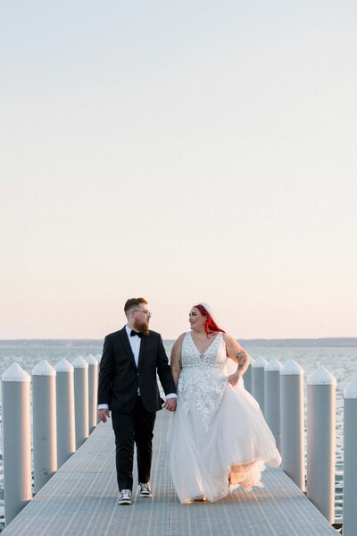Gulf coast wedding couple take their sunset portraits at secluded pier in Milton, Florida. 