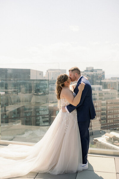 Bride and Groom walk down the aisle with a dusty blue, sage, and white bouquet at the St. Julien Hotel in Boulder, Colorado.