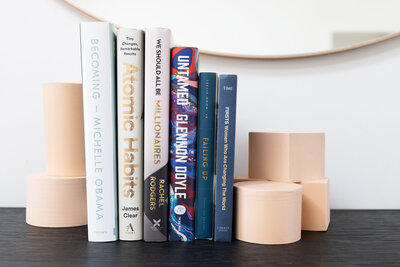 6 books gently stacked between bookends