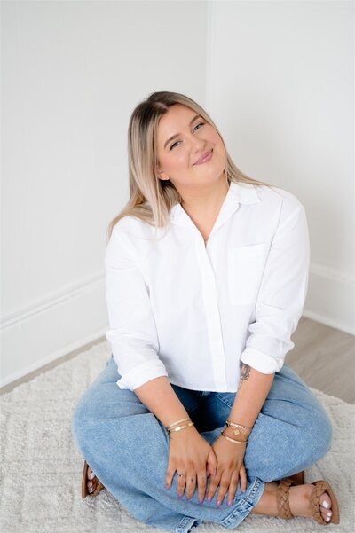 Chelsea, a makeup artist in Boston Massachusetts, laughs while posing for photos. 