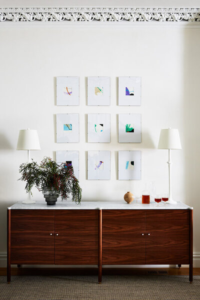 Brownstone interior designer updated a South End brownstone with original plaster molding and modern furniture, blending old and new. Featured by Rue Magazine.