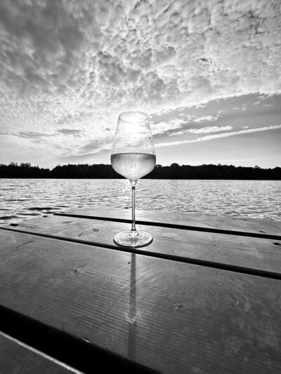 Photo of wine glass by the lakeside by AMALYN @amalynstyle and @amalynsocial 