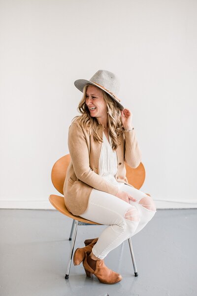 sitting down wearing a cute hat by Knoxville Wedding Photographer, Amanda May Photos