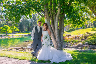 Bride and Groom at Japanese Gardens.  Groom leaning against a tree