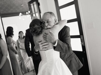 Emotional moment as father embraces his daughter.