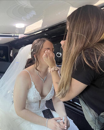 New York Day-of Coordinations, Most Valuable Bridesmaid, helping NYBride with makeup.
