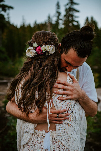 Couple hugging during their romantic mountain top elopement on the Sunshine Coast B.C