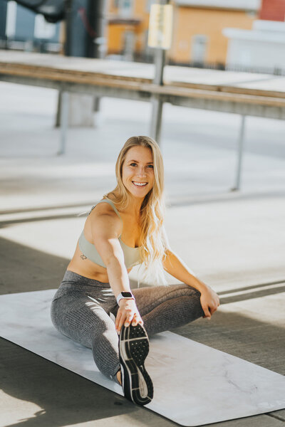 woman stretching on a yoga mat