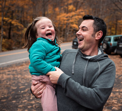 father and daughter laughing in stowe vermont