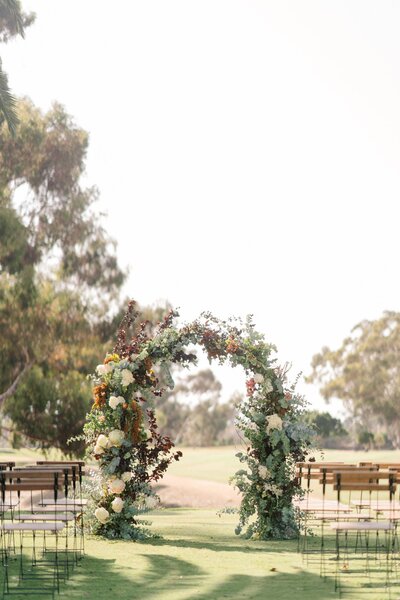 Ceremony floral arch at a Holman Ranch wedding in Carmel Valley