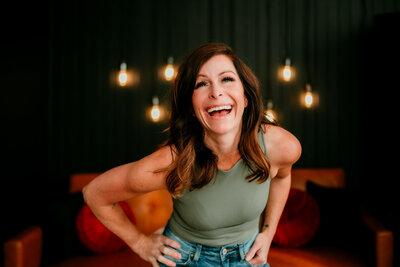 Modern and clean LinkedIn headshot of a professional woman smiling confidently.