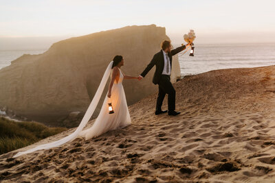 eloping couple at dusk with lanterns