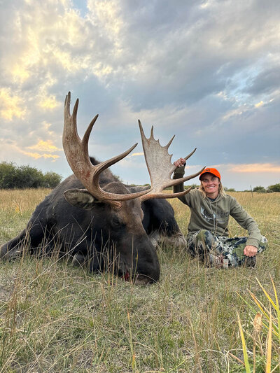 Female hunter with Colorado moose