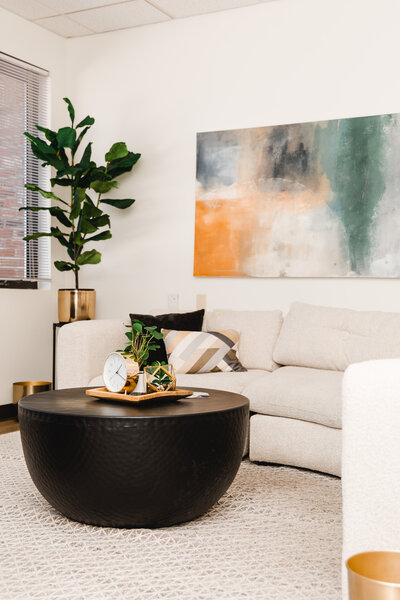 a couch and table inside a therapy office