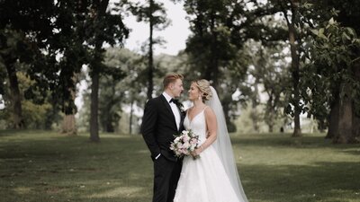 bride and groom smiling