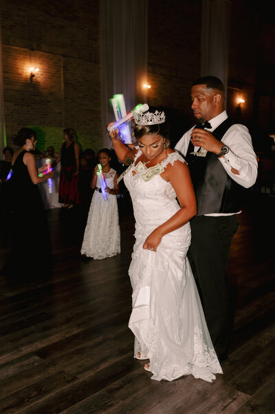 A bride and groom have a dance outside of their churh
