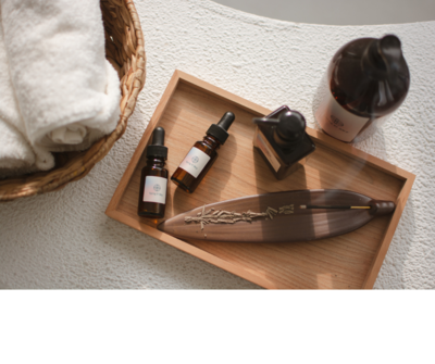 Spa oils and towels arranged for wellness treatment in Yarmouth, NS