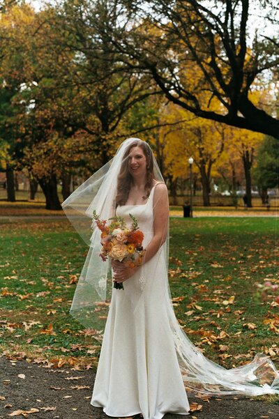 Film Photo Scan of bride looking straight holding bridal bouquet