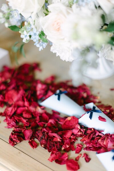 Bespoke flower petal bar and red petals spread on the table in palace Coburg Vienna