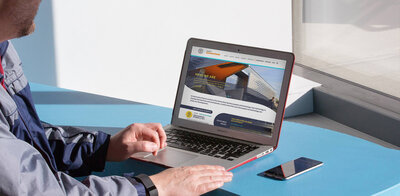 An editorial photo of a researcher exploring Cornell's CIS website, an example of Courtney's agency and website design experience