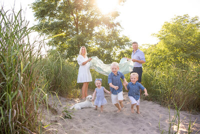 A beautiful family having family photos at the beach near London, Ontario