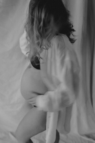 Mom photographed in a linen cover-up during New York City maternity photoshoot