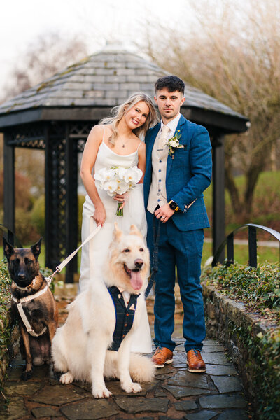 A newly wed couple with their dogs outside Mytton Fold taken by wedding photographer Anthony Horseman