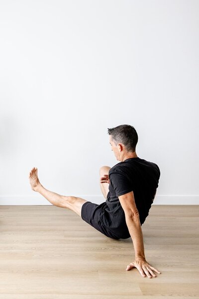 Chris Warden, founder of Embody Health & Performance, Doctor of Physical Therapy stretching
