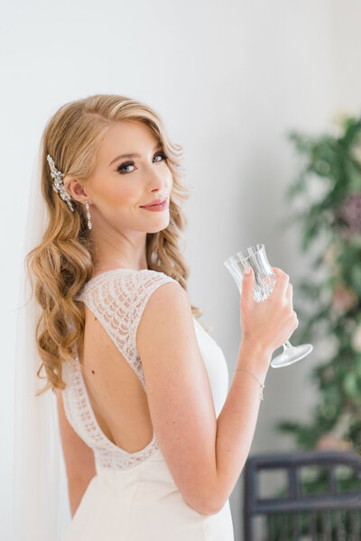 Bride holding champagne flute