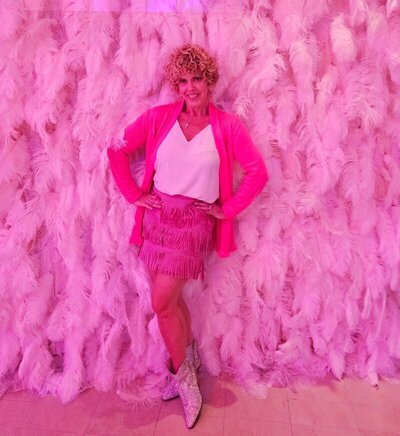 GG Mack, best personalized travel concierge smiling and wearing pink