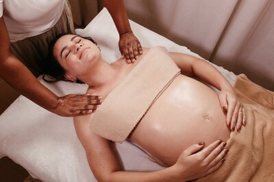 woman receiving a prenatal massage