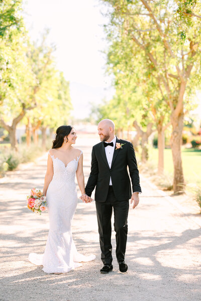 Bride and groom walking at Bougainvillea Estate