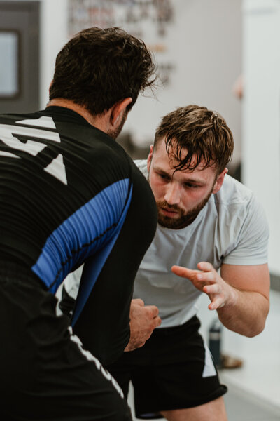 two men grappling in a no gi class at IRONGRIP jiu jitsu