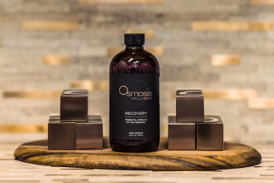 osmosis md skincare products sitting n wooden tray