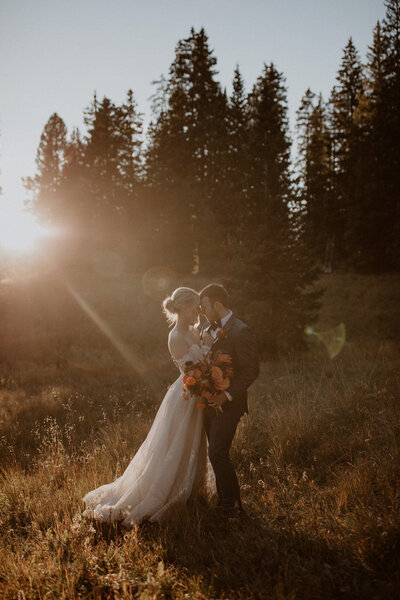 Bride and groom kiss in the mountains during their Telluride elopement