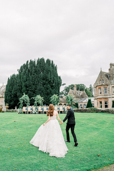 Bride and Groom Strolling on Estate Grounds at Luxury Napa Wedding