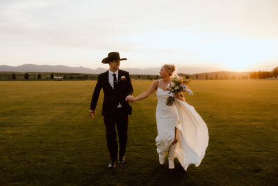 Engagement photo of a couple at sunset in Wyoming, with a romantic outdoor setting and soft natural lighting.