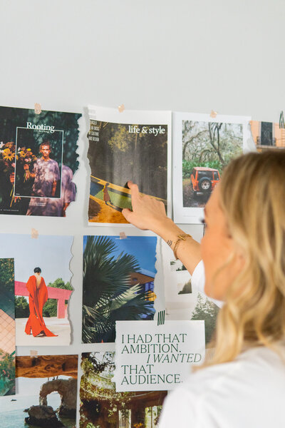 Robyn pointing at a mood board