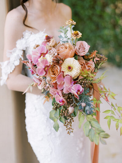 A wedding bouquet with overflowing pink roses at a luxury wedding in northern california