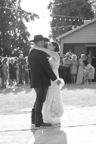 A stunning black and white photo from a western wedding in Eugene, Oregon, captured by a candid wedding photographer. This timeless image preserves the raw emotions and authentic moments of your special day, highlighting the beauty of a western wedding celebration.