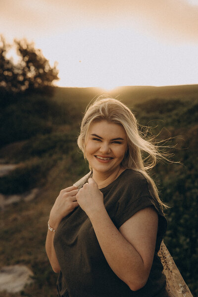 Sunshine Coast photographer capturing a natural, joy-filled portrait of a woman in golden hour light.