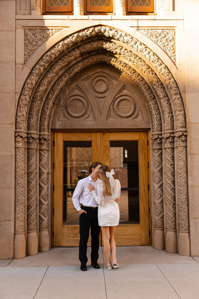 couple shares a kiss during engagement photos in arizona