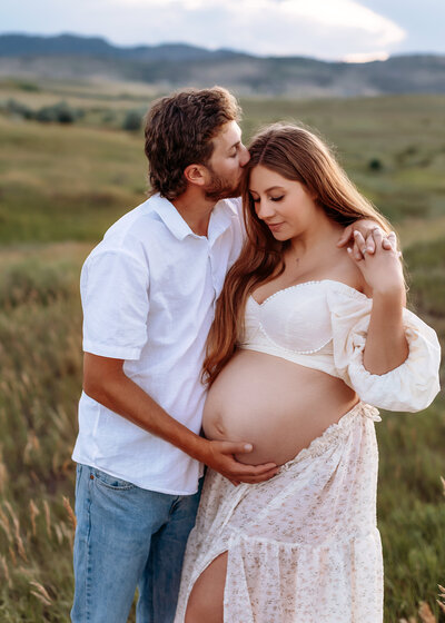 Fort Collins maternity photos featuring a serene outdoor lakeside location