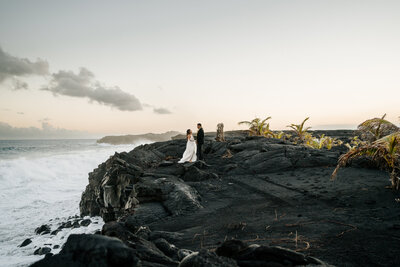 Hawaii couple on black lava rock