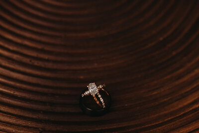 Wedding session photo of rings placed on chair