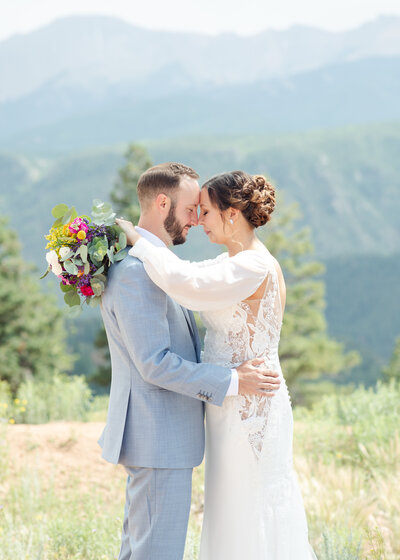 Brian and Theresa taking portraits at their mountain wedding near Colorado Springs.