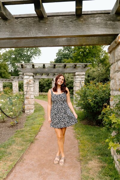 girl poses for senior photos in kansas city missouri
