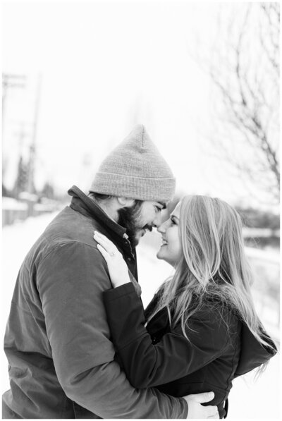 Missoula engagement photos of couple nose to nose standing in the snow