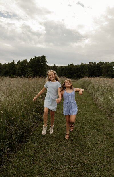 This heartwarming image captures the carefree joy of children skipping together on a sun-dappled afternoon in New England. As a lifestyle photographer passionate about preserving natural, unscripted moments, I aim to tell authentic stories through candid photography. This scene is a perfect example of the laughter, movement, and magic of childhood—frozen in time with gentle New England charm.